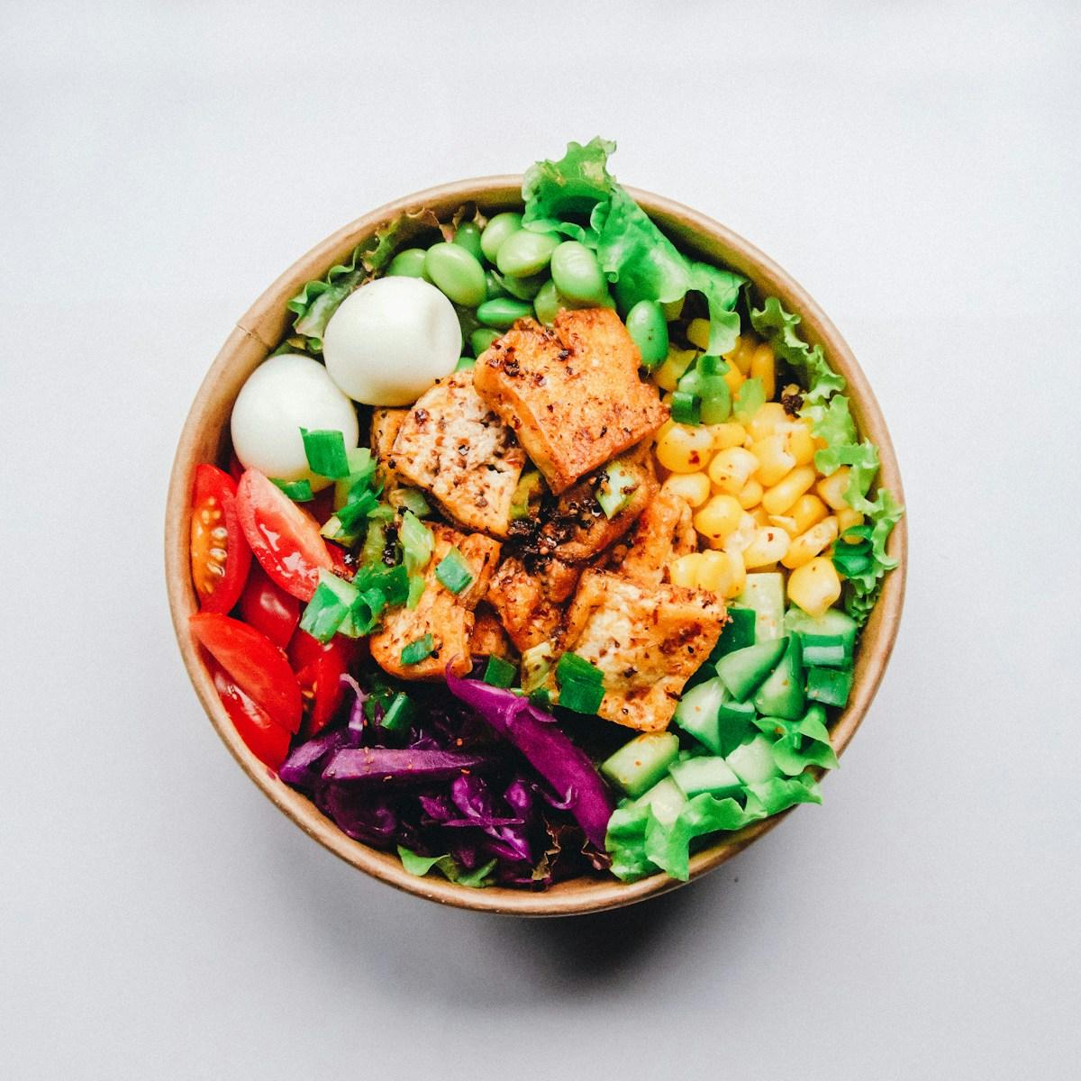 An example meal in a bowl with vegetables and greens